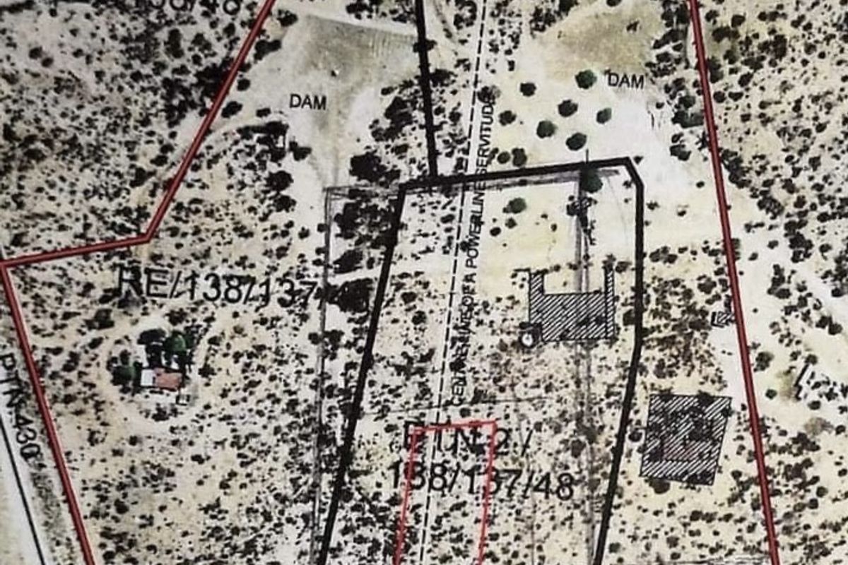 Aerial view of the commercial vacant land plot showing property boundaries, existing dams, and designated powerline servitude areas.
