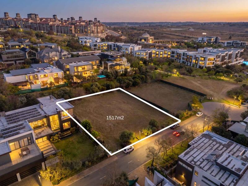 An aerial view of a 1517m2 vacant residential plot situated within a developed estate, offering prime building potential in a scenic neighbourhood.