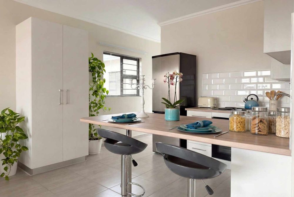 Modern kitchen with plenty of cupboards and separate, kitchen scullery.