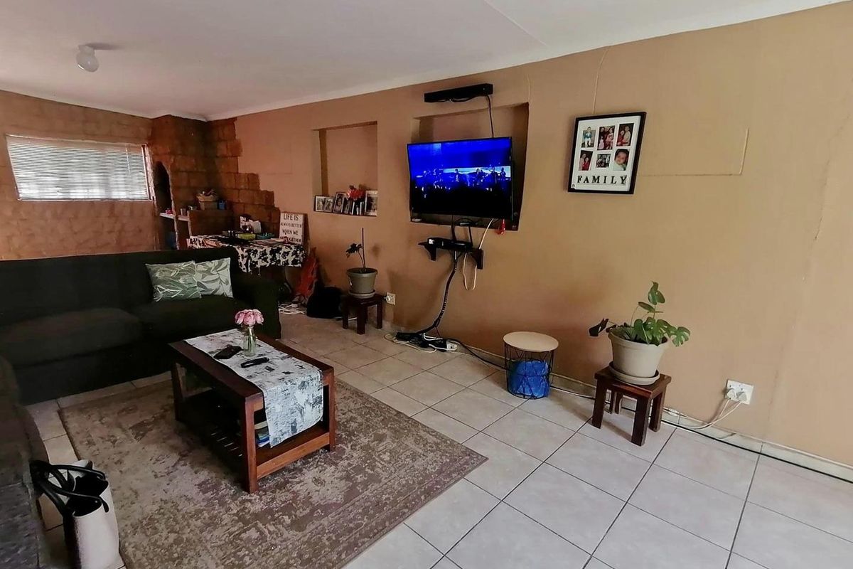 This charming 3-bedroom home offers spacious living areas, a modern kitchen, and a cozy backyard perfect for relaxation. - Photo 3