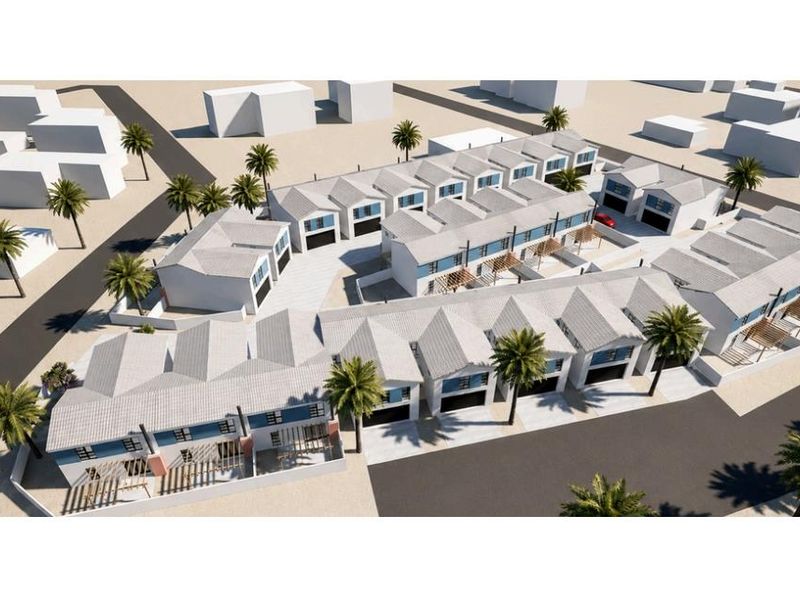 An aerial 3D render showing the layout and exterior design of a modern townhouse complex with paved driveways and integrated garages.
