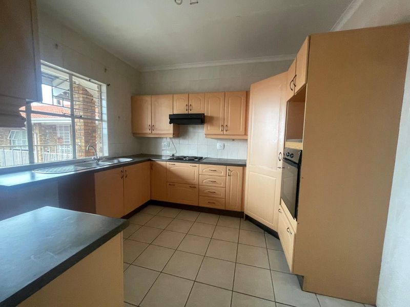 Bright 1st Floor Unit with Modern Kitchen & Balcony Retreat - Photo 5