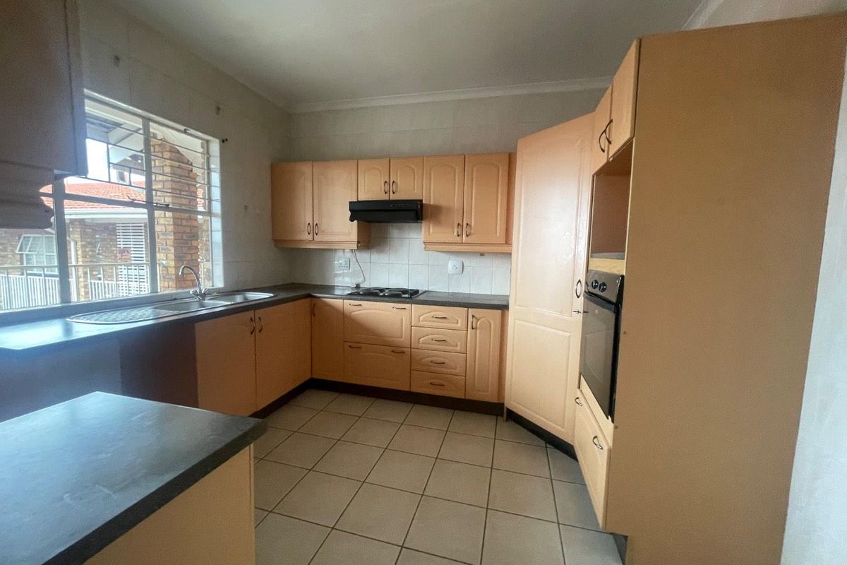 Bright 1st Floor Unit with Modern Kitchen & Balcony Retreat - Photo 5