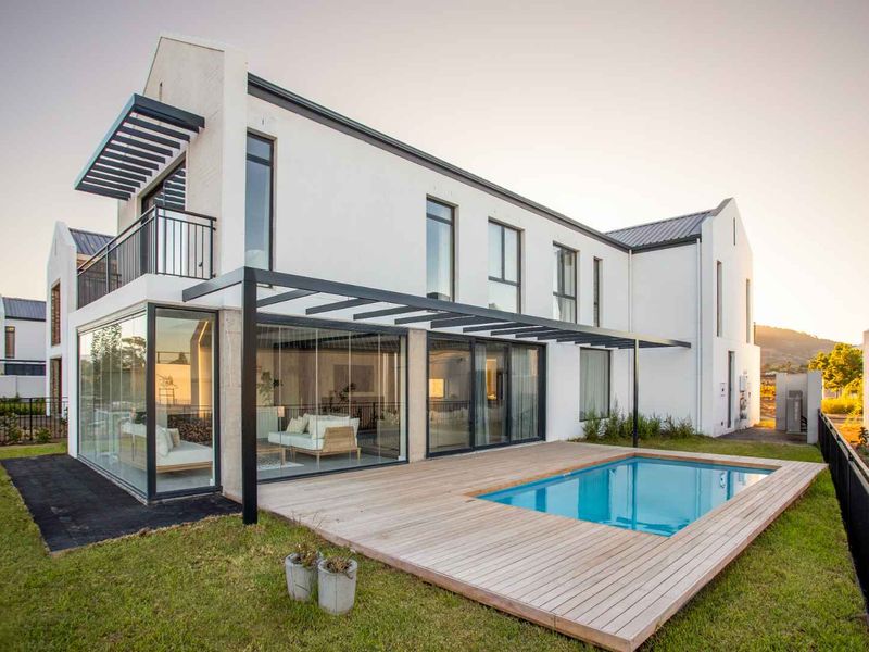 A home designed for refined family living with seamless indoor–outdoor elegance - Photo 2