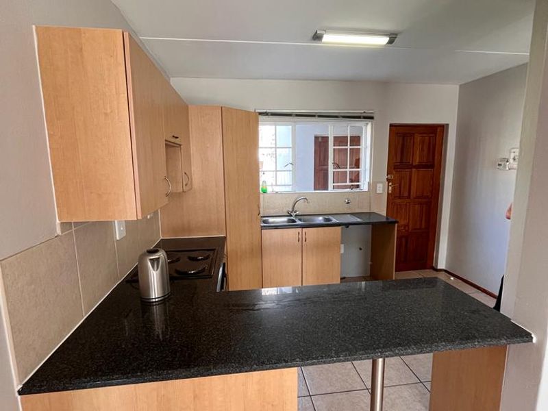 Sunny ground floor unit for sale in Elwood Complex, Rynfield - Photo 2