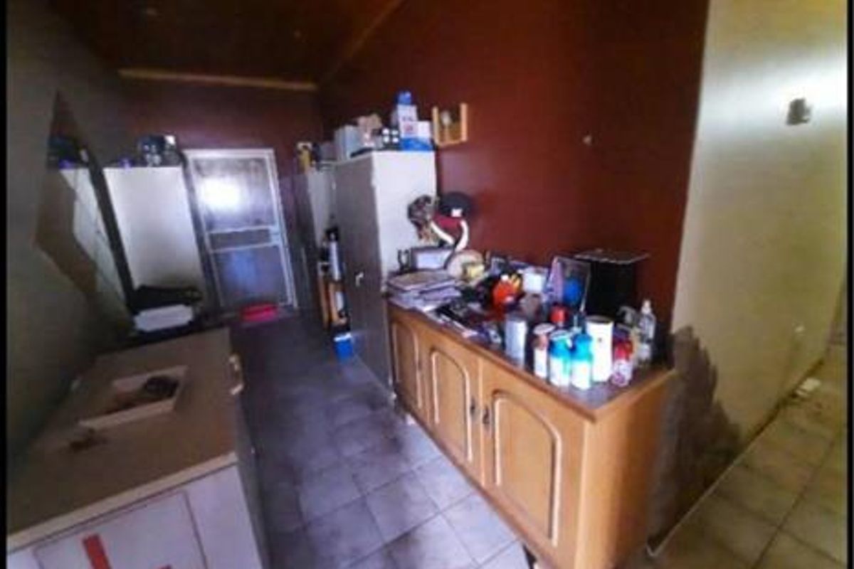 A multi-panel view showing a kitchen, scullery area, and bedroom with tiled flooring, wooden ceiling accents, and built-in cabinetry.