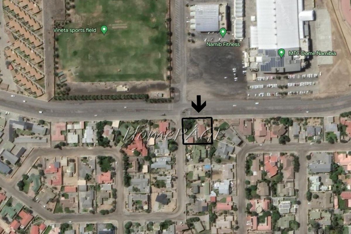 Aerial view of the property location within the neighborhood, highlighting its proximity to local sports facilities and main roads.