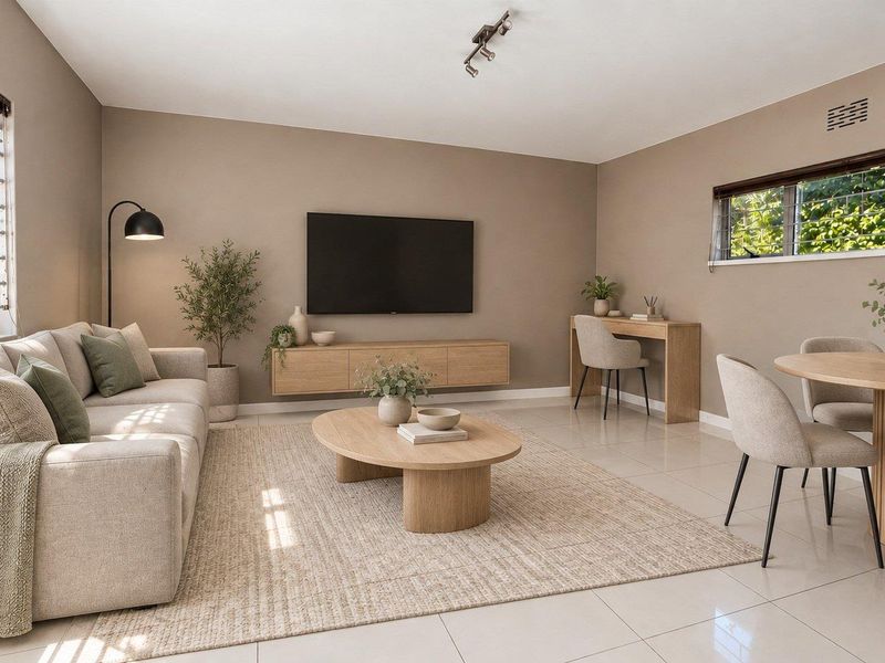 A bright and modern open-plan living and dining area featuring neutral tones, tiled flooring, and a sleek floating media console.
