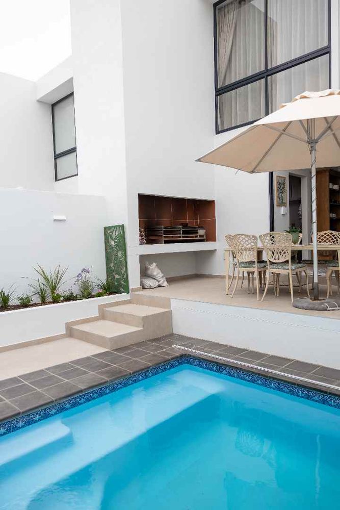 The private courtyard features its own dedicated entertainment area, complete with an outdoor BBQ.