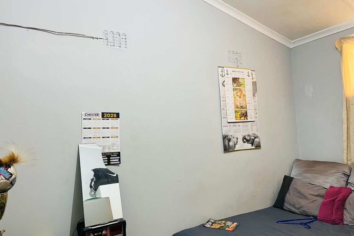 A bedroom featuring plain walls with coving and skirting boards, requiring minor cosmetic repairs and updates to improve the overall finish.