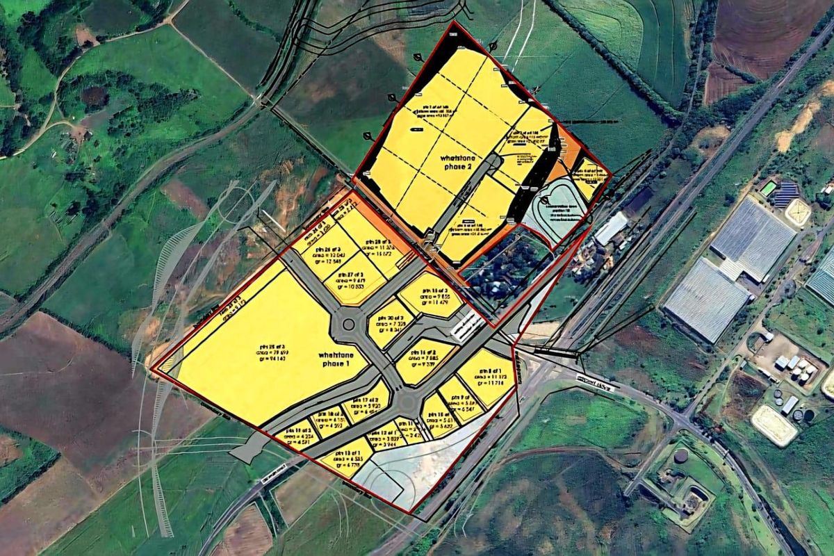 Aerial view of the Whetstone commercial development site, showing the layout of phase 1 and phase 2 plots within the surrounding landscape.