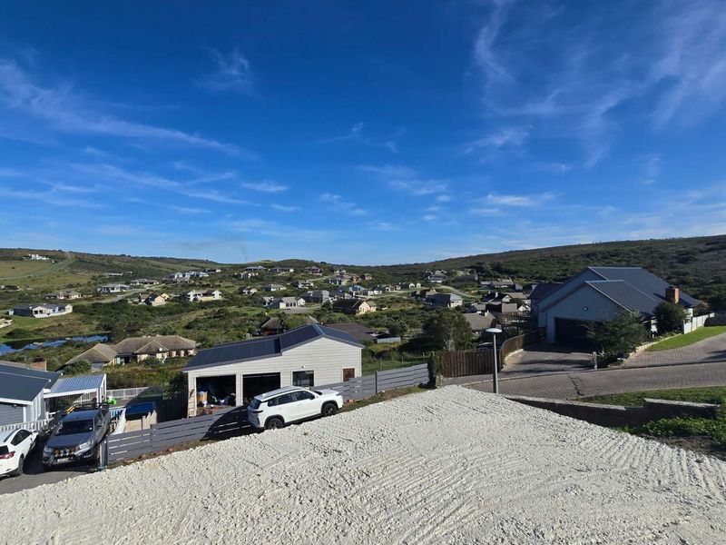 An elevated aerial view of the residential property and surrounding neighbourhood landscape.