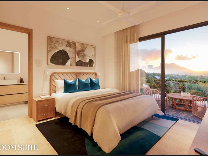 Modern bedroom suite featuring integrated lighting, en-suite bathroom access, and large sliding glass doors opening to a private balcony with scenic views.
