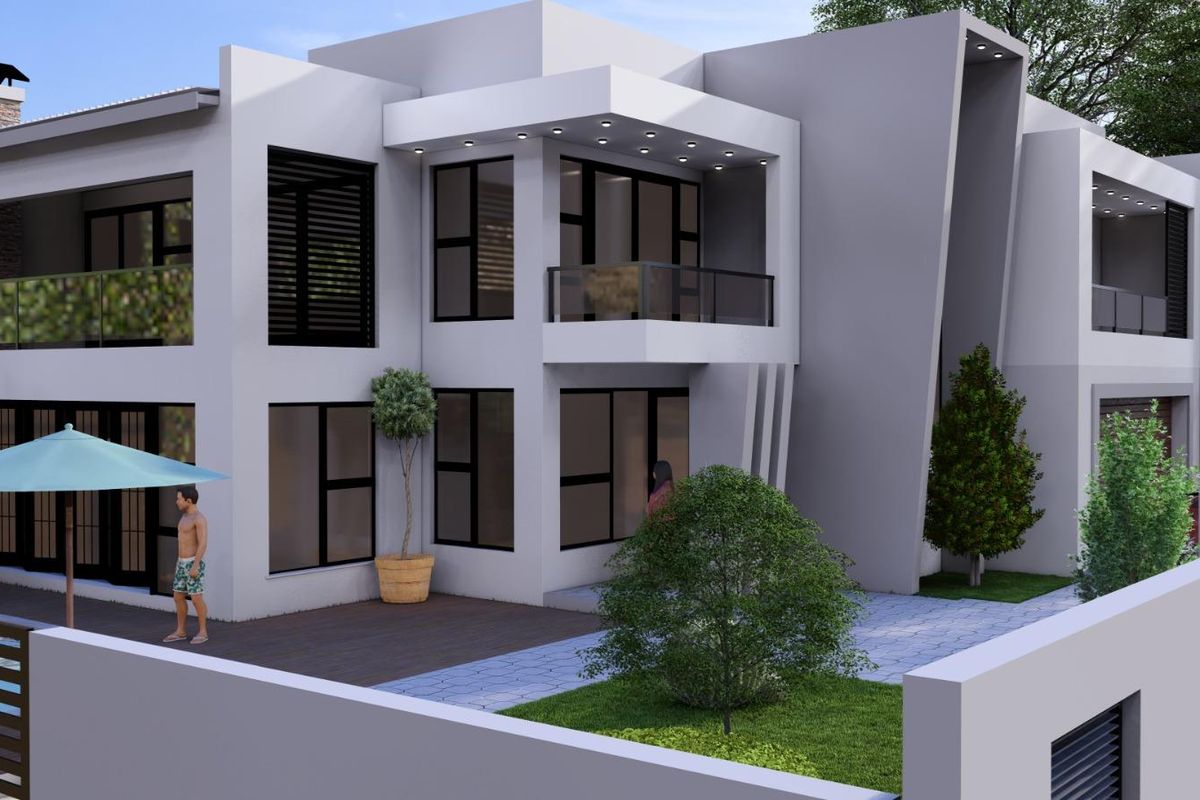 A modern two-story residential exterior featuring clean architectural lines, a private balcony, recessed lighting, and a paved patio area.