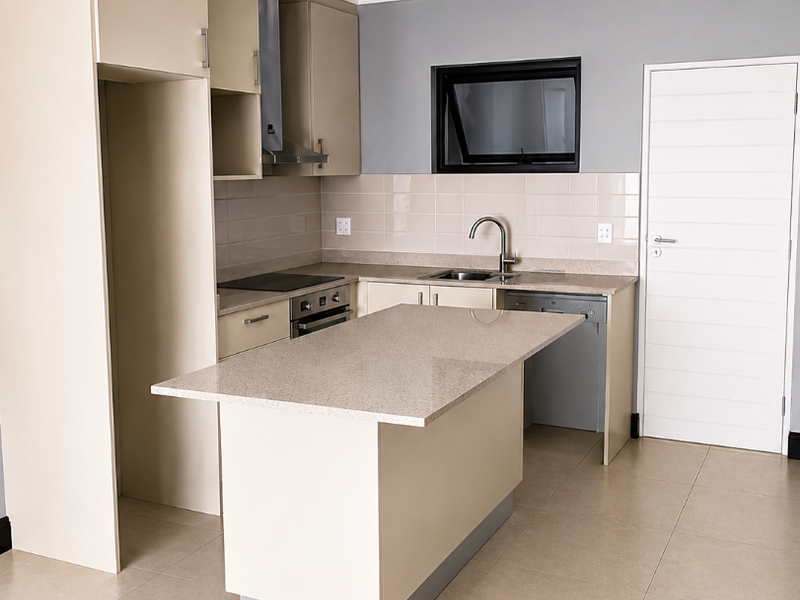 Modern kitchen featuring neutral cabinetry, stone countertops, a central island, integrated appliances, and tiled flooring in a clean, open-plan layout.
