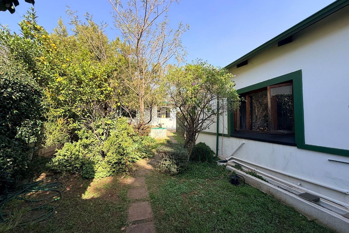 Charming 2-Bed Home with Two Bonus Units for Extra Income - Photo 3