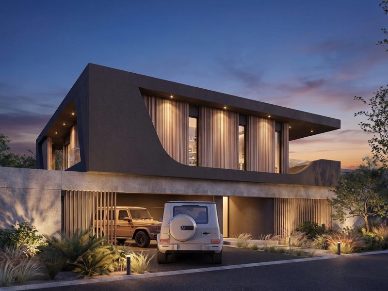A contemporary architectural exterior featuring a sleek dark facade, timber accents, integrated garage, and sophisticated landscape lighting at dusk.