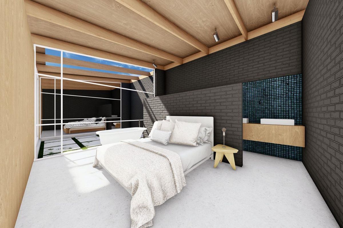 A modern bedroom featuring exposed timber ceiling beams, dark brick feature walls, and an open-plan layout with integrated bathroom vanity and large glass sliding doors.