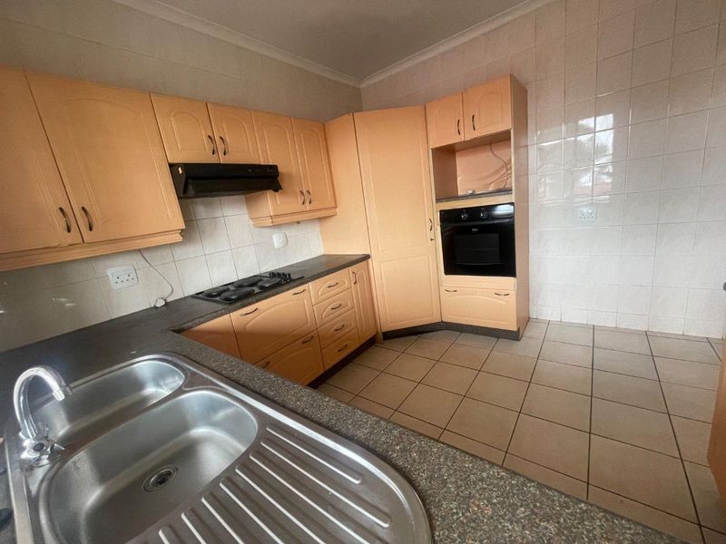Bright 1st Floor Unit with Modern Kitchen & Balcony Retreat - Photo 9