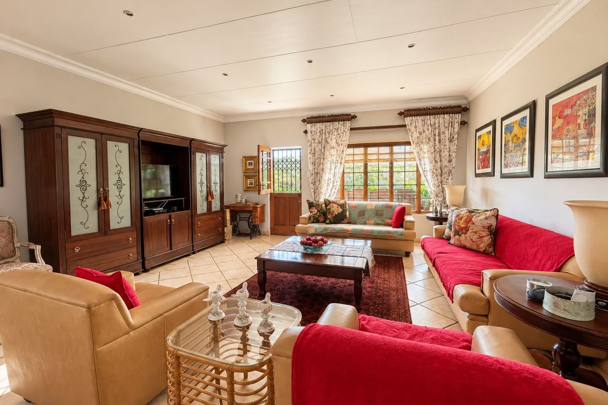Spacious living room featuring tiled flooring, recessed lighting, and crown molding, with direct access to the exterior through a secure door.