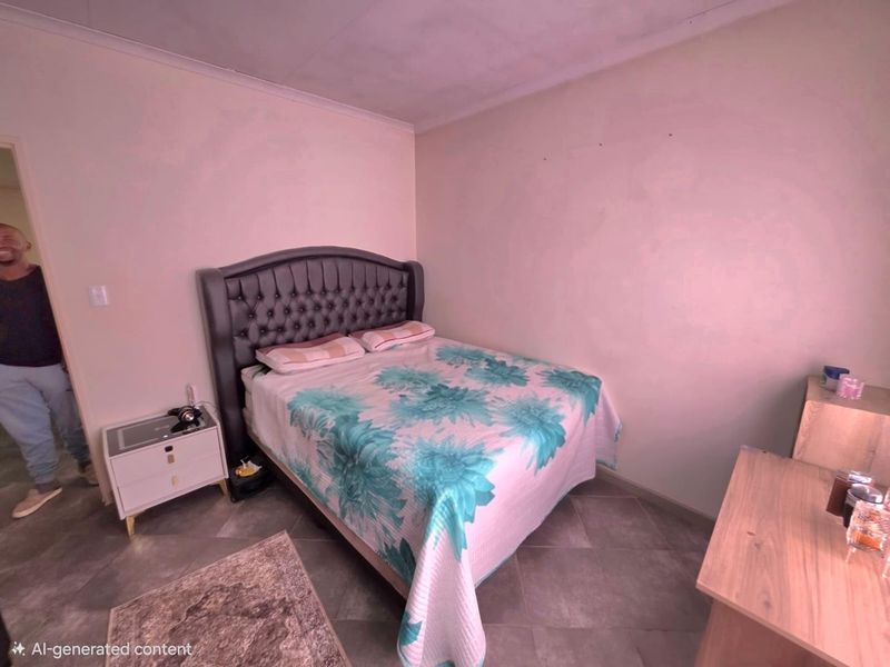 A bedroom featuring tiled flooring and coved ceilings, currently requiring cosmetic updates to the wall finishes.