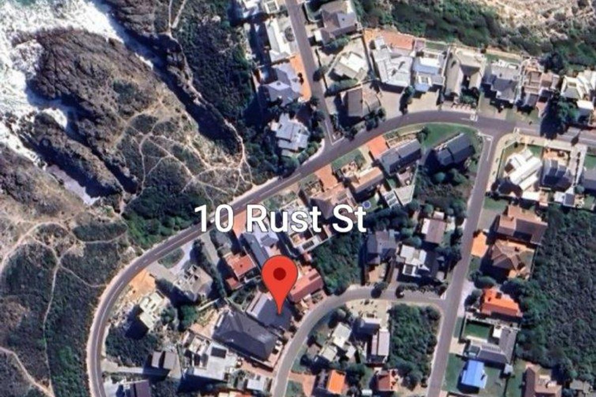 Aerial view of the property located at 10 Rust Street, showcasing its coastal position and surrounding neighbourhood layout.