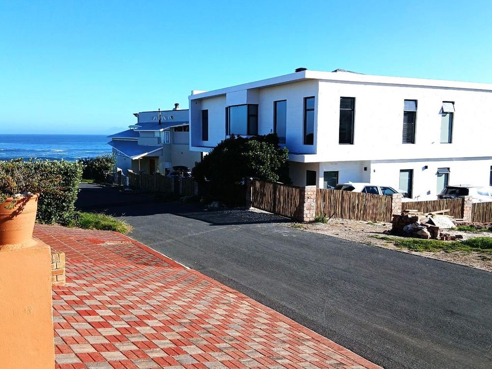 2 UPMARKET Houses directly in front of us - in between us and the Ocean.