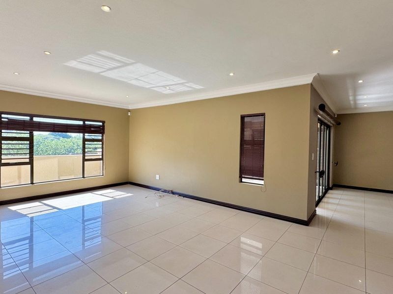 This spacious freestanding townhouse offers comfortable family living with excellent security and stylish finishes throughout. - Photo 3