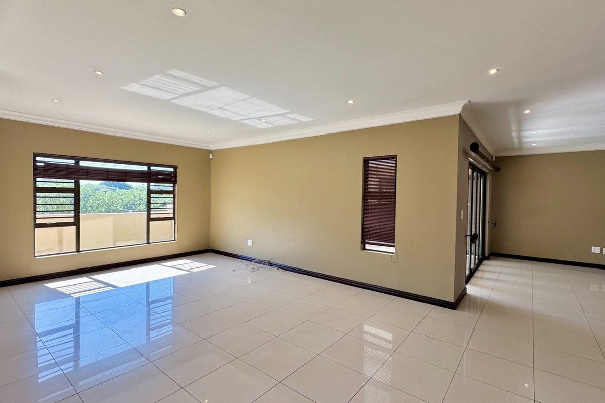 This spacious freestanding townhouse offers comfortable family living with excellent security and stylish finishes throughout. - Photo 3