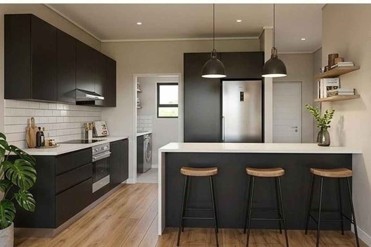 Modern kitchen featuring matte black cabinetry, white subway tile backsplash, stone countertops, and a functional island with breakfast bar seating.