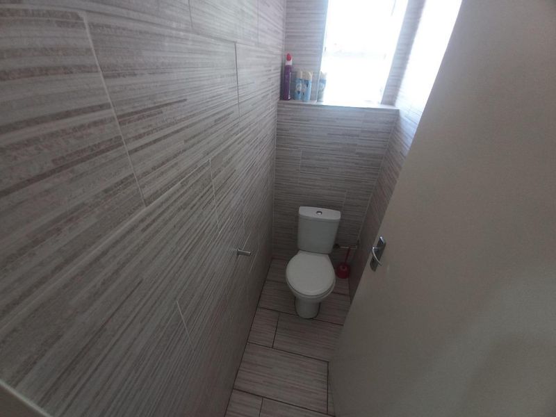 Your Perfect Haven: 2 Bedrooms, Cozy Living Space, Modern Kitchen, and Secure Comfort - Photo 10