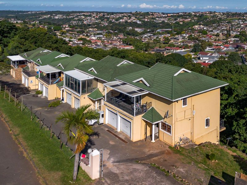 Spacious Hillside Townhouse with Scenic Views & Great Potential - Photo 1