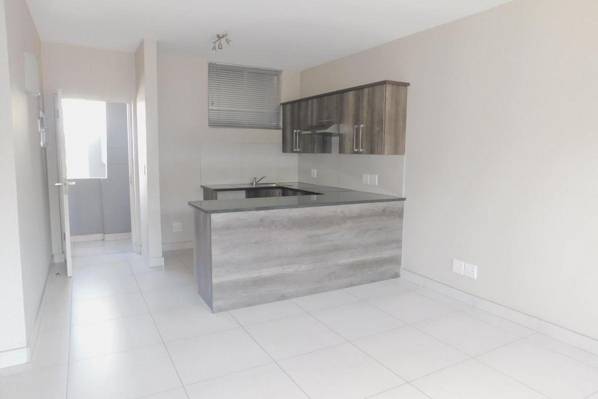 This modern one-bedroom, third-floor apartment offers comfortable living in a secure and well-maintained complex. - Photo 3