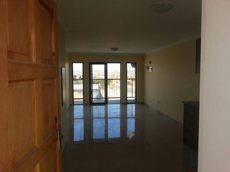 2 BEDROOM APARTMENT FOR SALE IN OTJOMUISE – WINDHOEK Modern, neat and spacious 78 m2 apartment situated on the 3rd floor of a secure complex in Otjomuise. - Photo 2