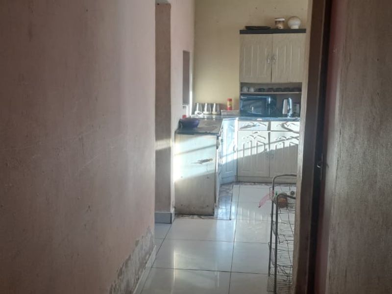 Peaceful 3-Bedroom Family Home with 2 Rondavels for Extra Income Potential - Photo 3