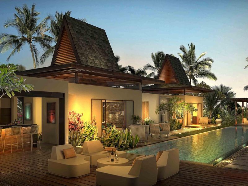 A luxurious outdoor pool area featuring timber decking, a swimming pool, and a covered bar area with architectural pitched roof design.