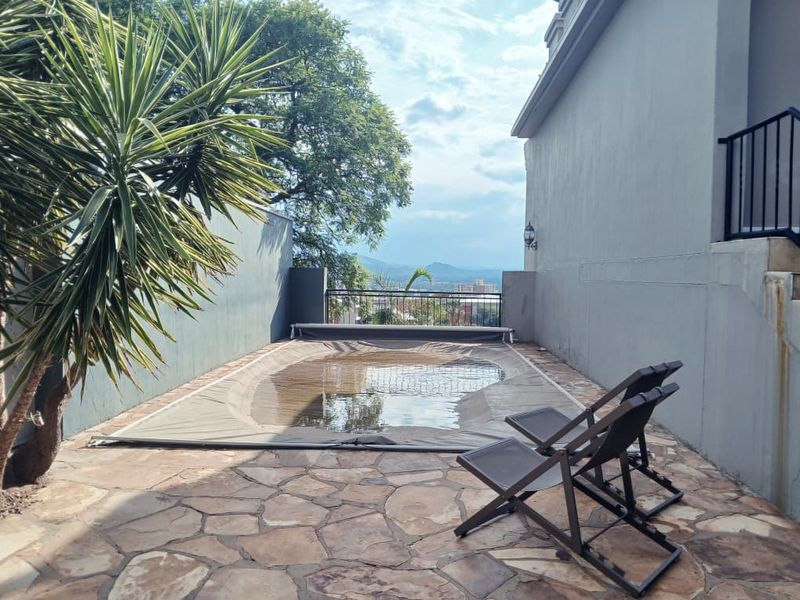 Spacious double-story home on a generous 2,296 m2 residential erf in Windhoek's sought-after suburb - Photo 10