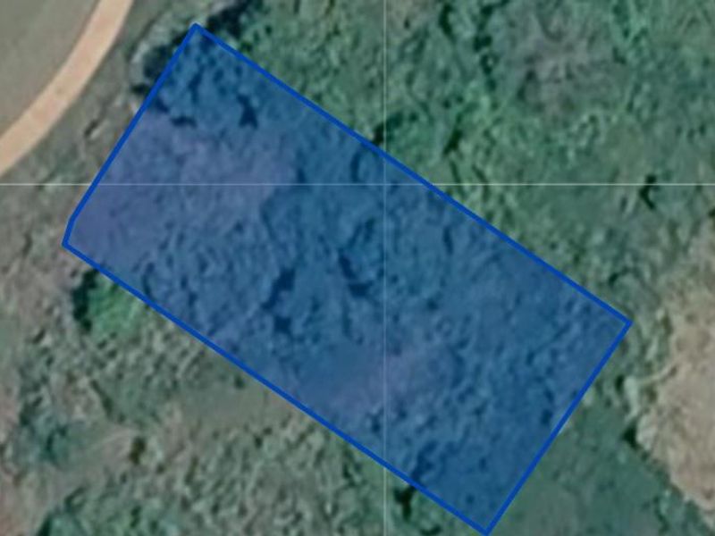 An aerial view showing the boundaries of the vacant residential land plot.