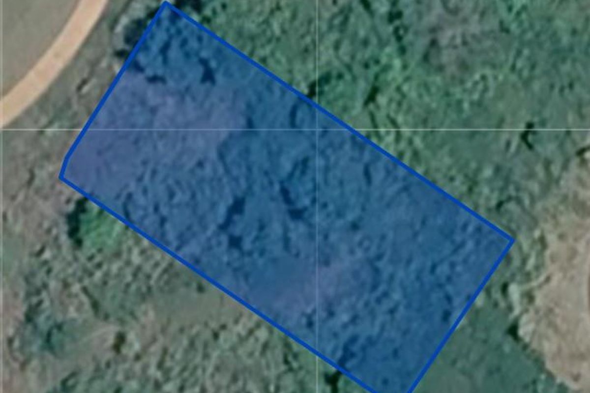 An aerial view showing the boundaries of the vacant residential land plot.