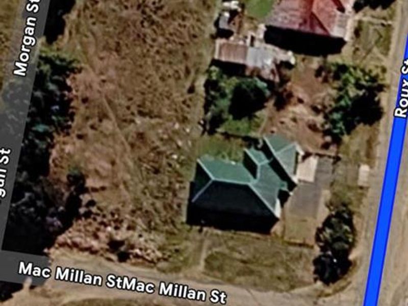An aerial satellite view of the residential land parcel showing surrounding street layout and existing site orientation.