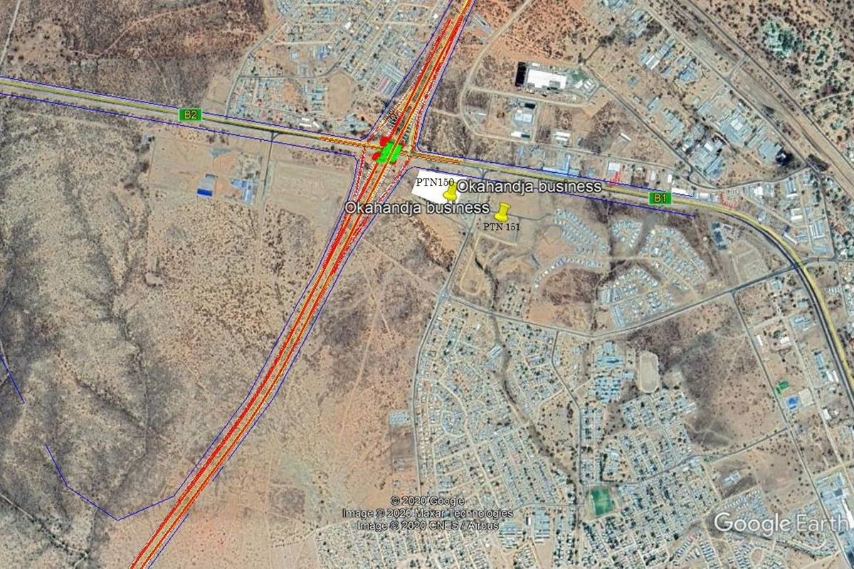 Aerial satellite view showing the commercial land parcel location in relation to major highway infrastructure and surrounding urban development.