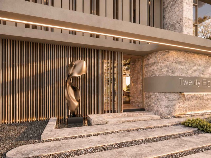 Modern architectural front entrance featuring stone cladding, timber slat detailing, integrated water feature, and sophisticated LED lighting design.
