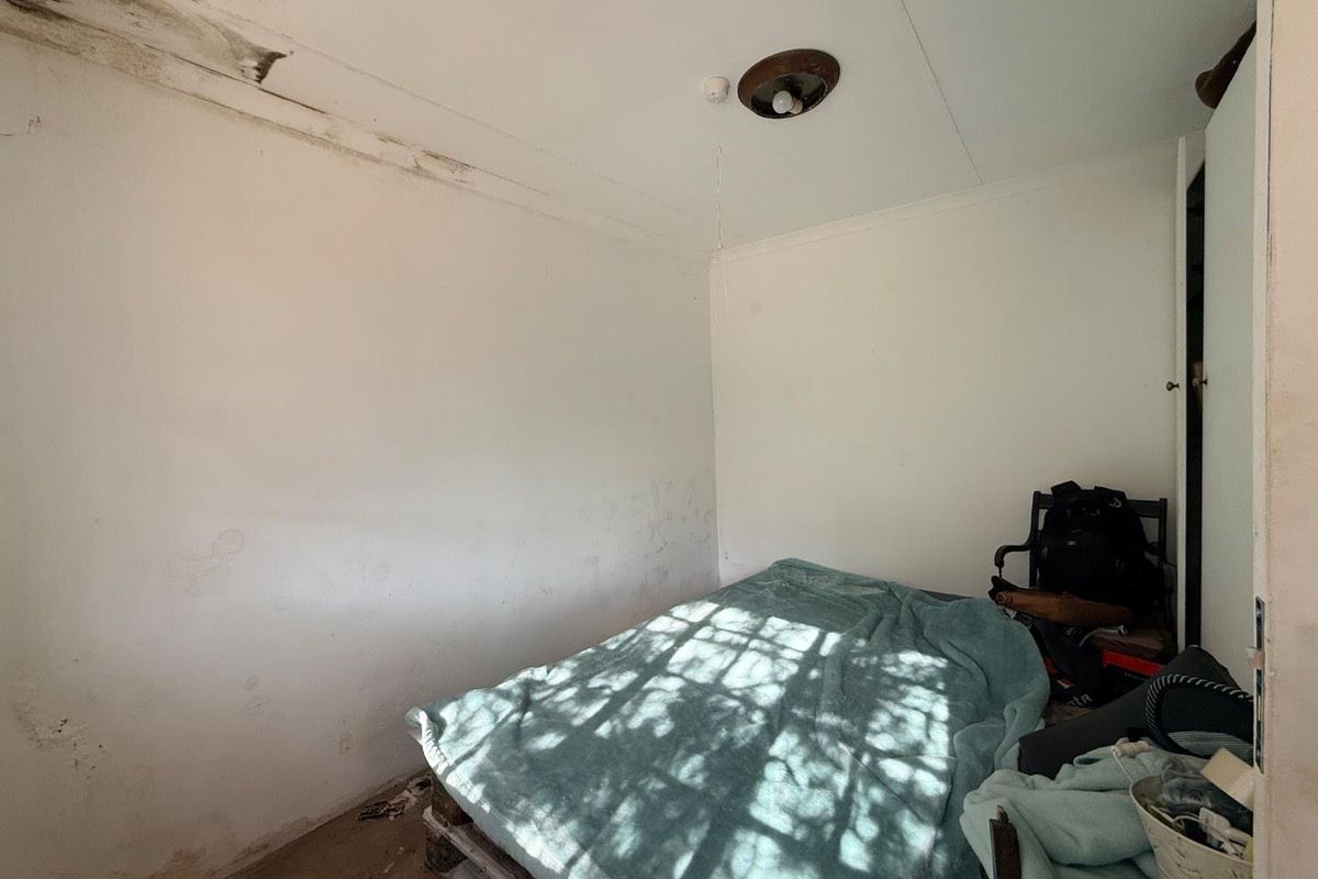 Charming 2-Bed Home with Two Bonus Units for Extra Income - Photo 5