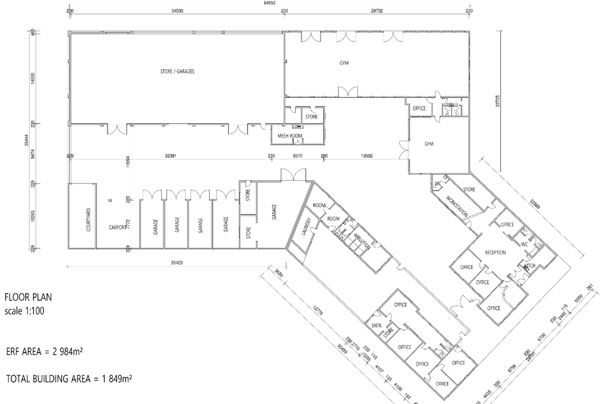 A detailed architectural floor plan showing the layout of the business premises, including offices, garages, gym, and storage areas.