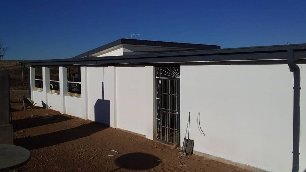 Back view of second house as well as an entrance