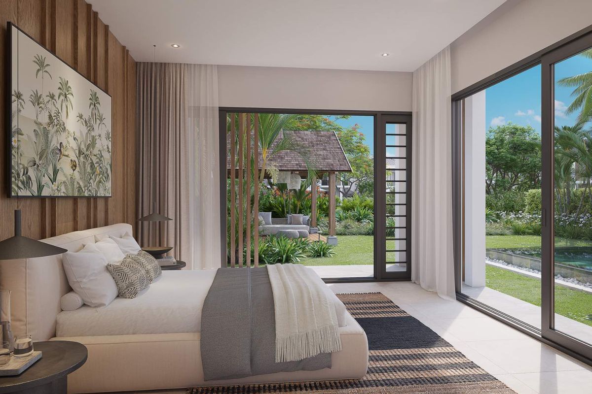 A modern bedroom featuring floor-to-ceiling sliding glass doors that open onto a private garden and pool area, with elegant wood-paneled accent wall.