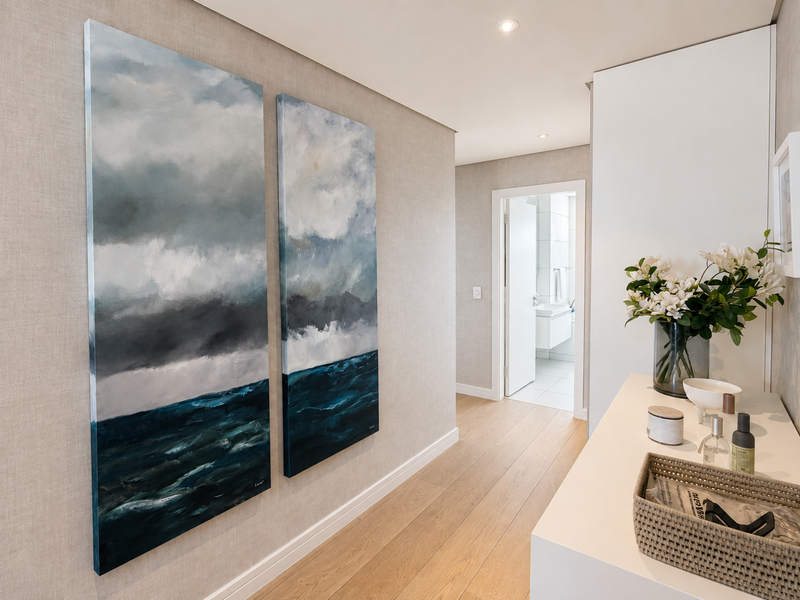 A well-lit, modern hallway featuring timber flooring, textured wallpaper, and recessed downlighting, leading towards a bathroom.