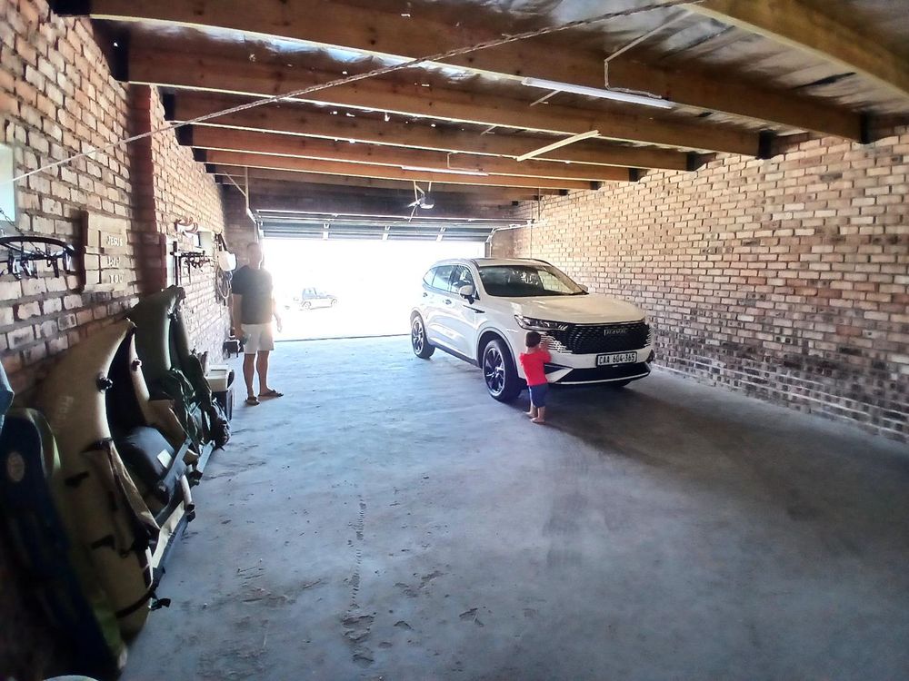 Our same SPACIOUS Garage - VERY easily accommodating 4 Motor Vehicles.