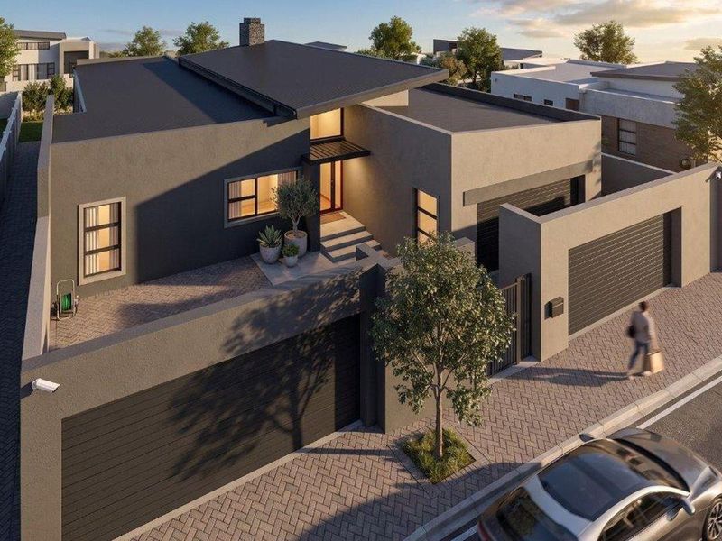 Aerial perspective of a modern contemporary house featuring a flat roof, double garage, and paved driveway within a secure estate setting.