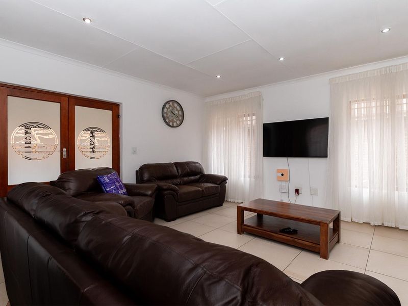 Lovely 3-bedroom facebrick home with a pool situated in a secure estate in Glen Marais - Photo 8